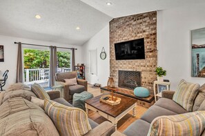 Télévision, baby-foot, table de tennis de table, livres