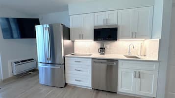 Fridge, microwave, stovetop, coffee/tea maker