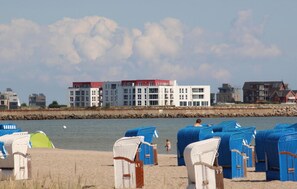 On the beach, water skiing