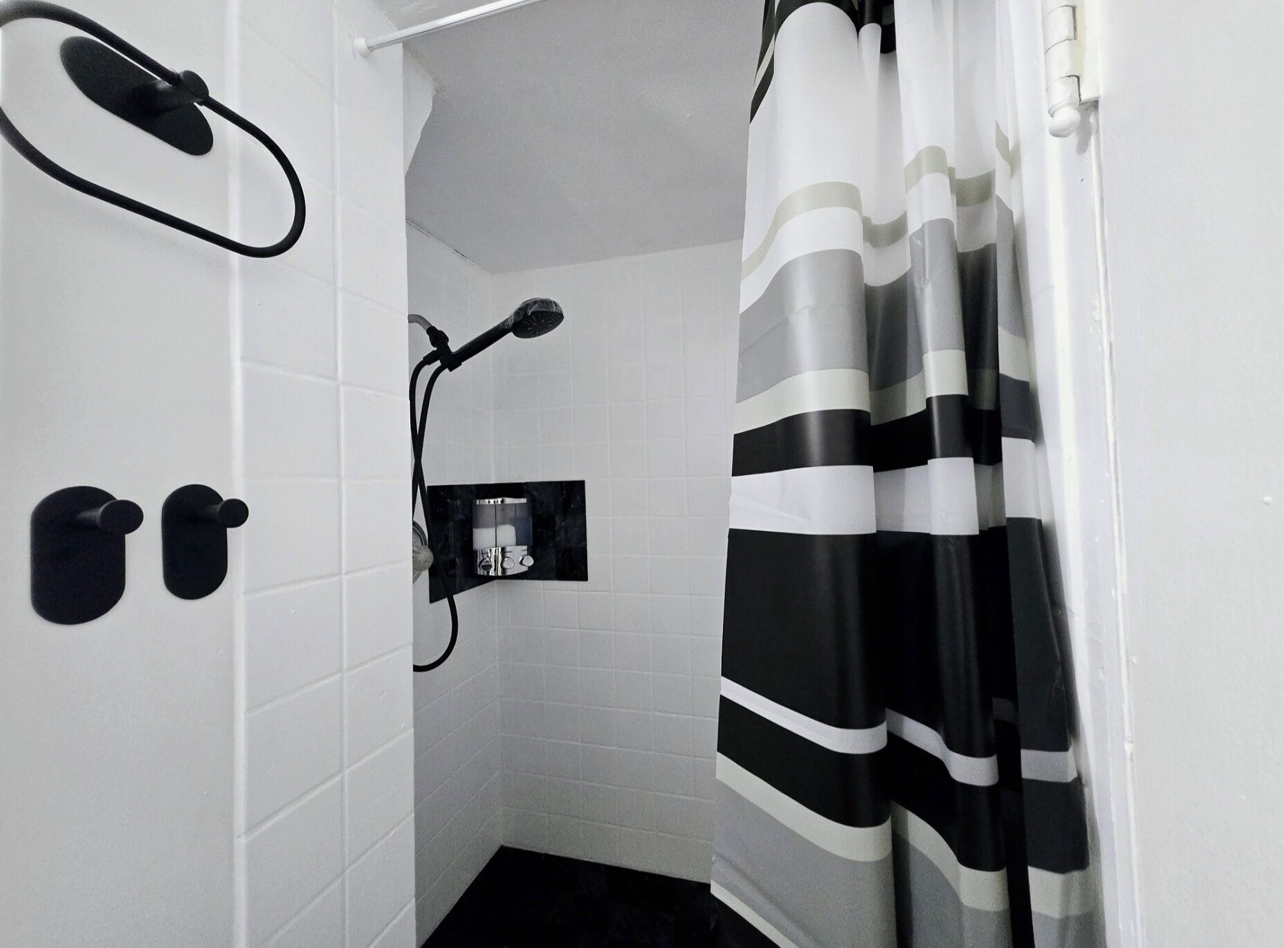 Shower, hair dryer, towels, toilet paper