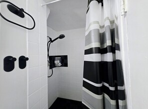 Shower, hair dryer, towels, toilet paper