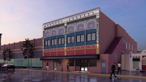 A multi-story building with a brick facade, large windows, and a flat roof. - The Well Hotel & Taproom  (Trinidad)