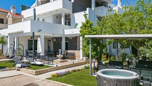 A modern two-story house with a covered patio, outdoor seating, and a swimming pool. - Amazing apartment in Vodice with WiFi (Vodice)