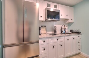 Fridge, microwave, stovetop, coffee/tea maker