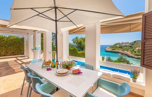 Outdoor dining - Stunning home in Cala Mandia (Cala Mandia)