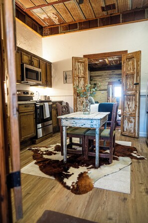 Dining - Cozy studio with queen pullout sofa on scenic working ranch in Fort Worth. (Fort Worth)