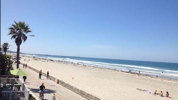 On the beach, sun-loungers