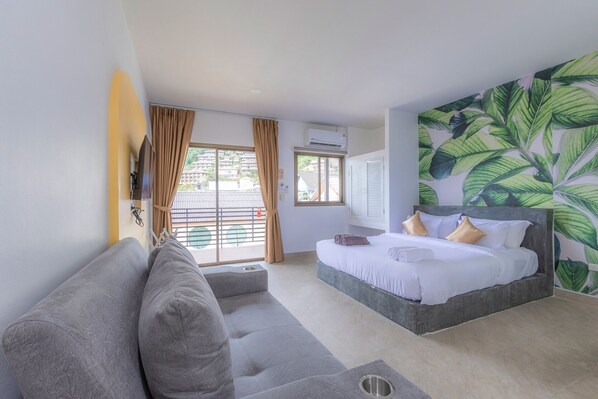 Triple Room, Balcony, Hill View | In-room safe, desk, laptop workspace, blackout drapes