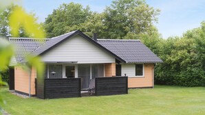 A single-story house with a gabled roof, a front porch, and a small deck. - Gorgeous home in Hemmet with WiFi (Hemmet)