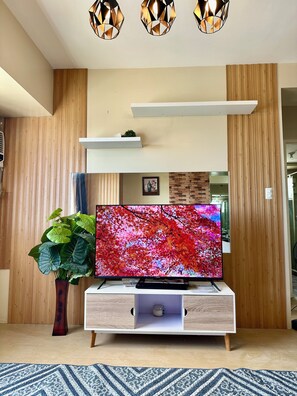 Comfort Apartment, Partial Ocean View | Living area | 55-inch LCD TV with digital channels, Netflix, streaming services - Wonderful One Bedroom at Avida No. 40 (Iloilo)
