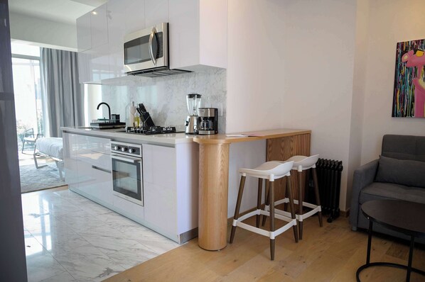 Microwave, stovetop, coffee/tea maker, toaster