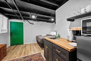 1 bedroom, desk, iron/ironing board, travel crib
