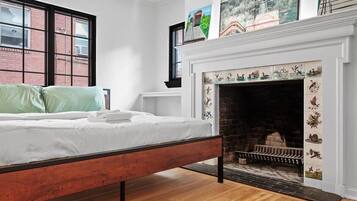 1 bedroom, desk, iron/ironing board, travel crib