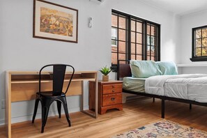 1 bedroom, desk, iron/ironing board, travel crib