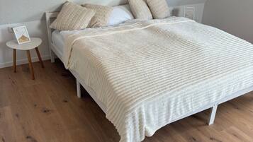 1 bedroom, desk, iron/ironing board, travel crib