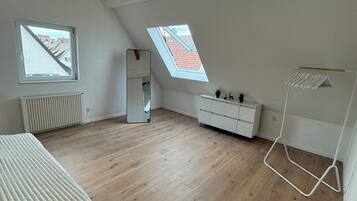 1 bedroom, desk, iron/ironing board, travel crib