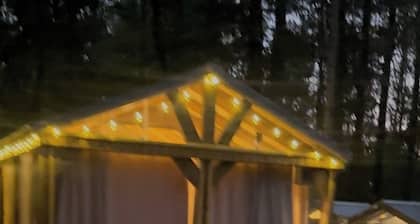 Mentone glamping getaway in a private screened in cabin in charming Mentone