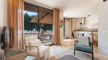 Deluxe Apartment, Sea View | Living area | LCD TV