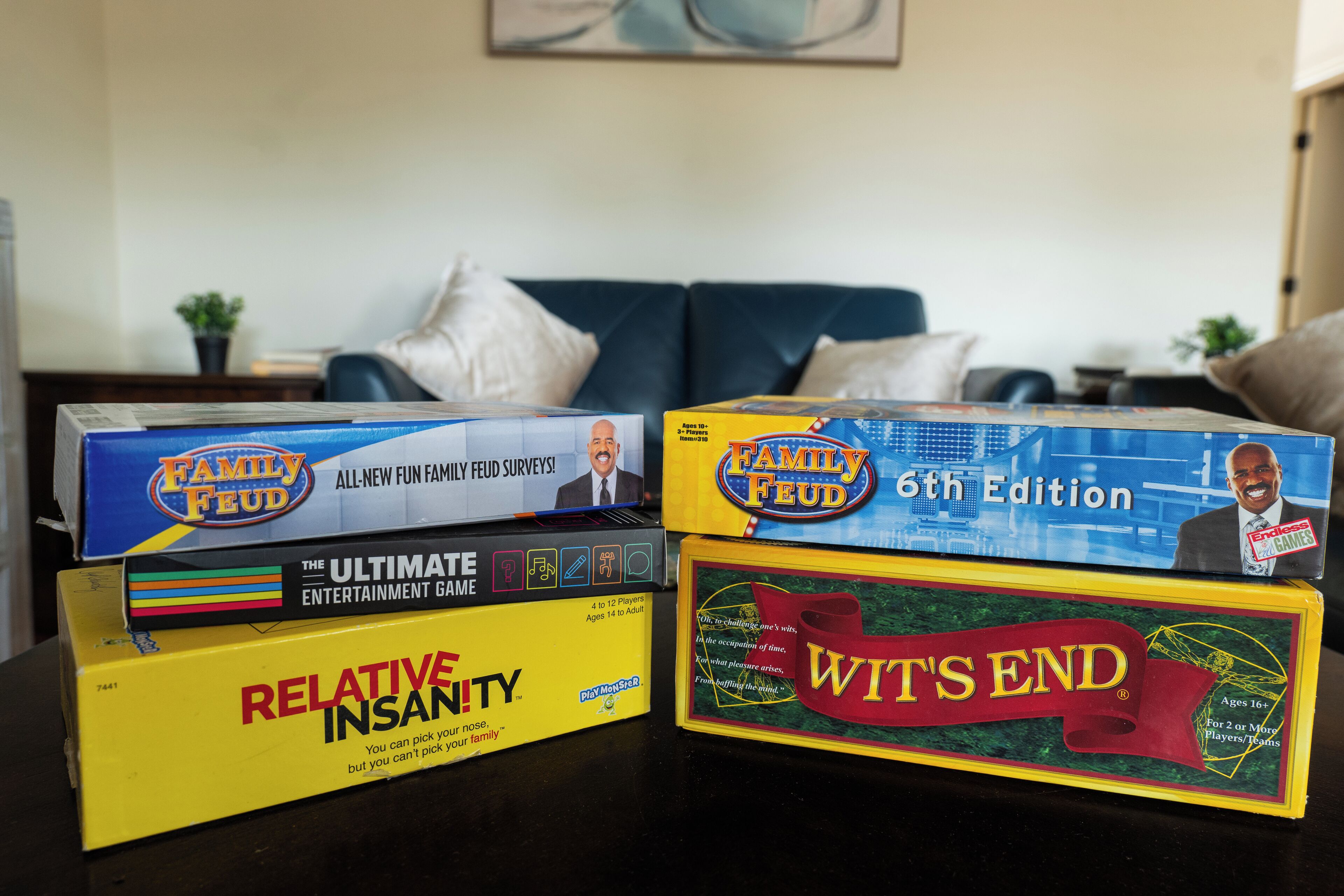 Four board games on a table.