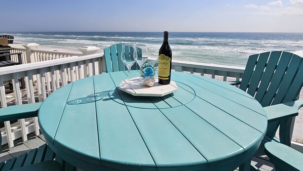 A turquoise table with two wine glasses and a bottle of Caymus Vineyard wine, overlooking the ocean. - 7B - 2BR $700+ in freebies incl golf, On Beach (Miramar Beach)