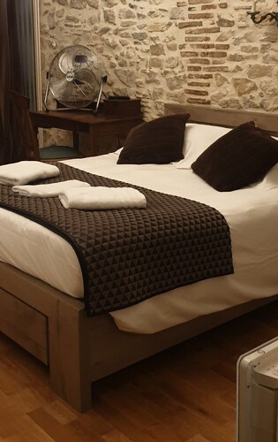 Comfortable rooms in a 16th-century building in the town center. 