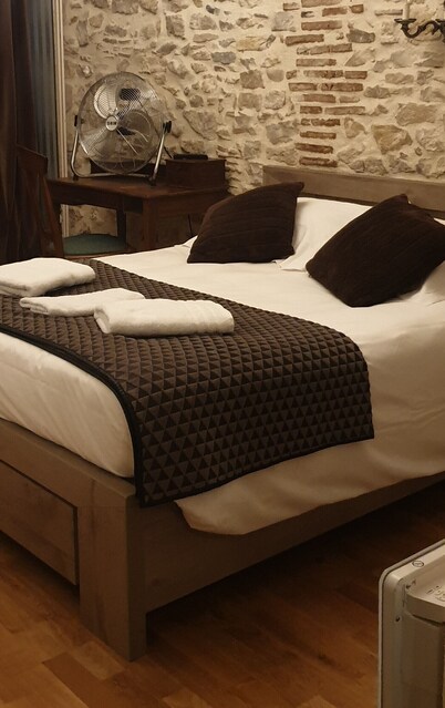 Comfortable rooms in a 16th-century building in the town center. 