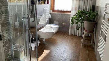 Shower, eco-friendly toiletries, hair dryer, bidet