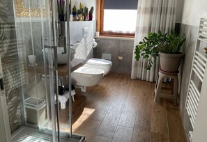 Shower, eco-friendly toiletries, hair dryer, bidet