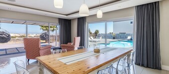 Spacious Beachfront Family Villa – 1 Min Walk to Beach, Pizza Oven, Fast WiFi!