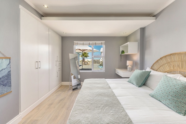 This bedroom has amazing natural light and spectacular views of the pool & ocean