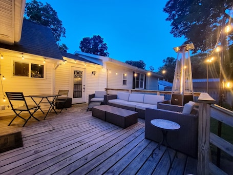 Outdoor dining. Cozy Family Getaway Steps from Little Paw Paw Lake