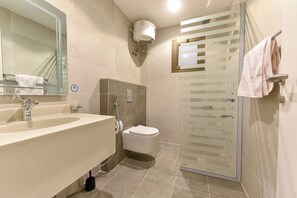 Shower, hair dryer, slippers, towels