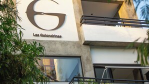 A building with a large 'G' logo and the name 'Las Colindrinas' on the facade. - Las Golondrinas Cabarete (Cabarete)
