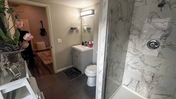 Shower, hair dryer, towels, soap