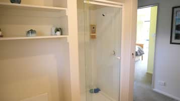 Shower, hair dryer, soap, toilet paper