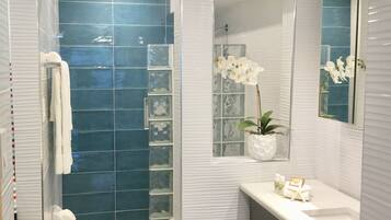Shower, hair dryer, towels, soap