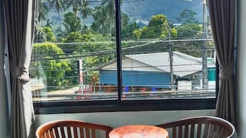 Basic Room, City View | Living area | 40-inch Smart TV with cable channels