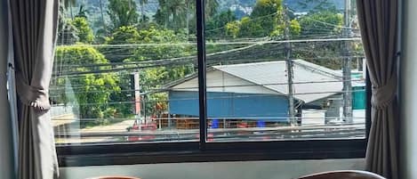 Basic Room, City View | Living area | 40-inch Smart TV with cable channels