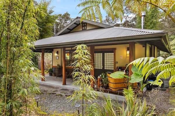 Our cottage is nestled in a serene private forest with traditional furo hot tub.