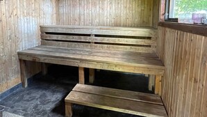 A wooden bench with steps inside a cabin. - 9 Person Holiday Home in Figeholm (Figeholm)