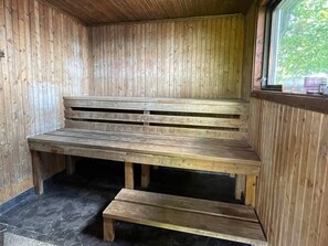 A wooden bench with steps inside a cabin. - 9 Person Holiday Home in Figeholm (Figeholm)