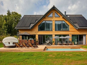 A modern two-story house with a large deck, outdoor seating, and a swimming pool. - Welcoming Villa With Amenities (Trutnov)
