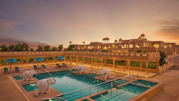 Outdoor pool, open 7:00 AM to 7:00 PM, pool umbrellas, pool loungers