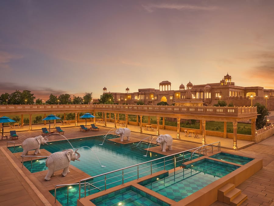 Outdoor pool, open 7:00 AM to 7:00 PM, pool umbrellas, pool loungers