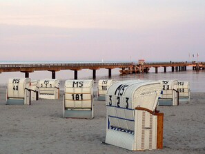 A beach with rows of mailboxes labeled MS 181, MS 326, and MS 42. - 5 Star Holiday Home in Grossenbrode (Grossenbrode)