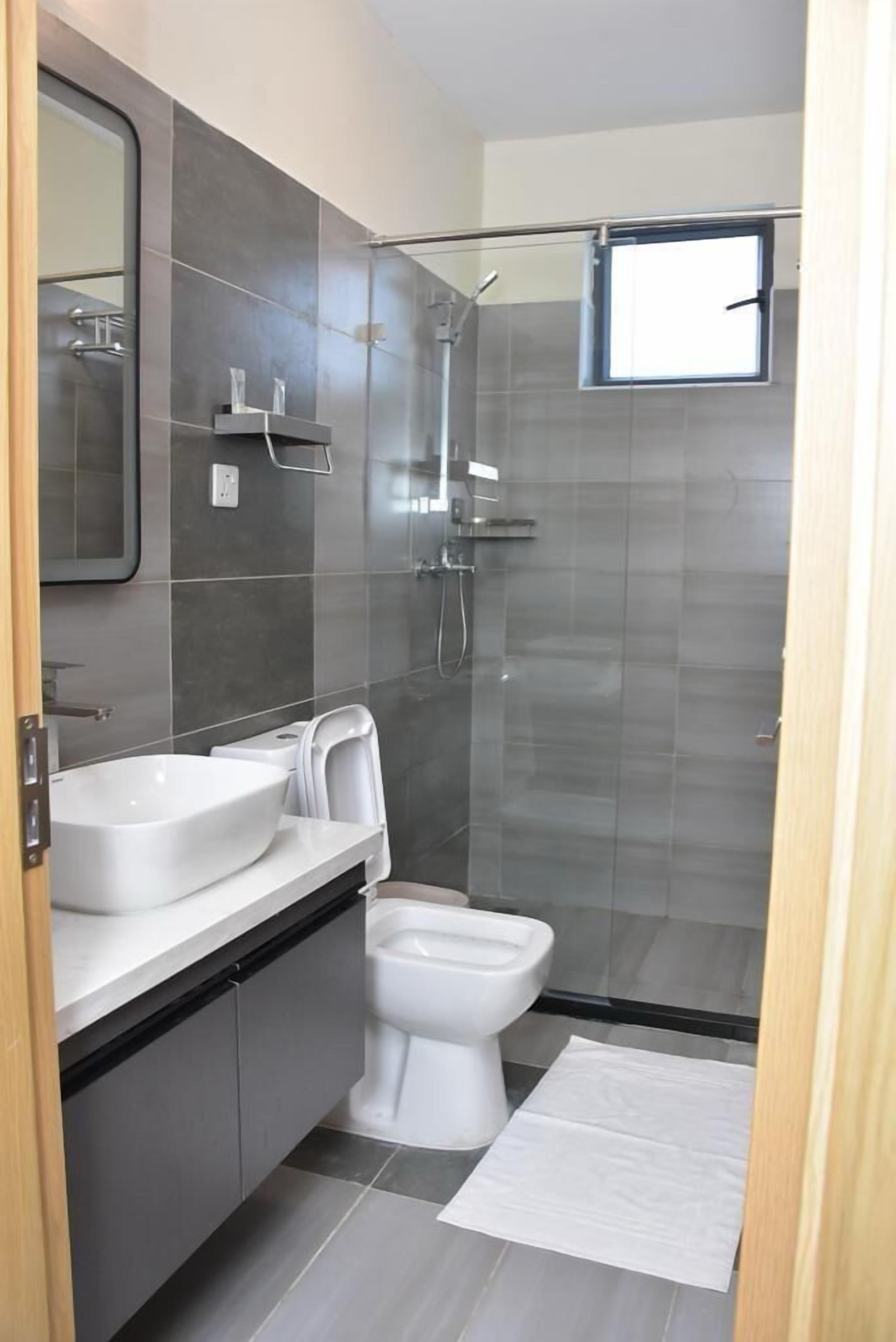 Family Apartment, Balcony, City View | Bathroom | Shower, slippers, towels, soap