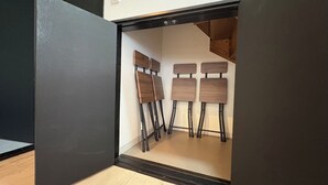 A room with a modern design, featuring a black-framed window and a wooden floor. - HARRISON (Sapporo)