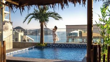 Outdoor pool, open 9:00 AM to 9:00 PM, pool umbrellas, sun loungers