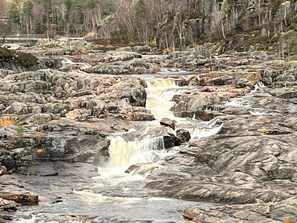 A rocky riverbed with a waterfall. - 6 Person Holiday Home in Tjorhom (Sirdal)