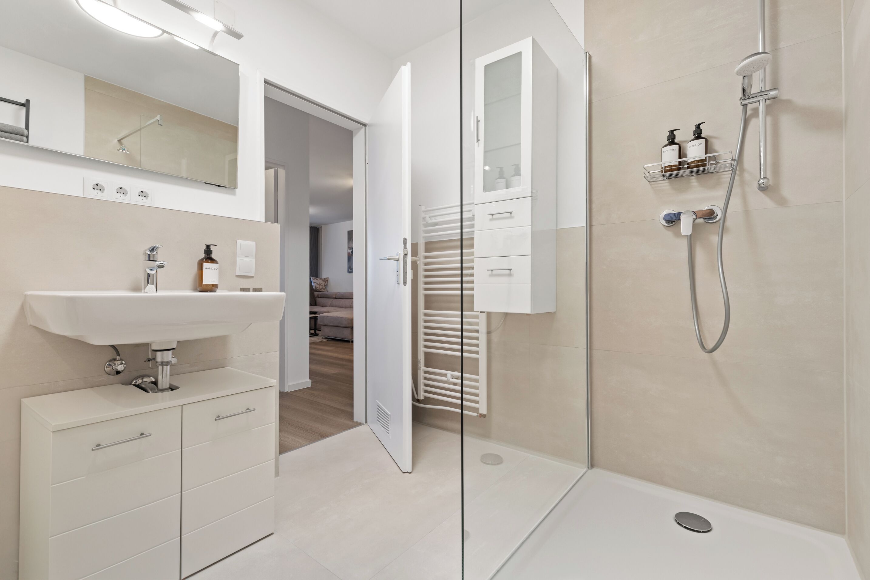 Shower, hair dryer, towels, soap